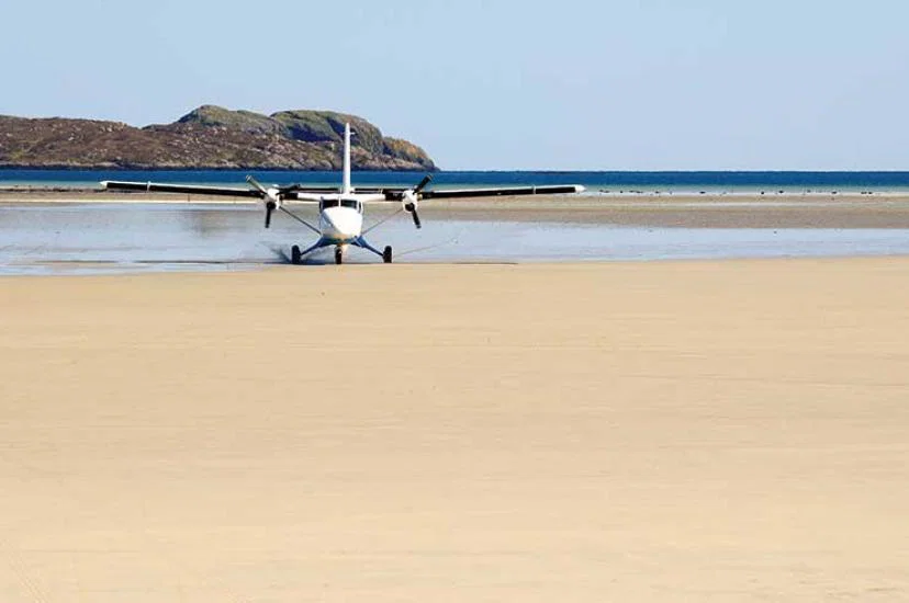 Light aircraft landing on beach iStock-174798675