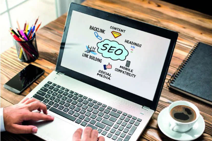 Picture of a laptop with an SEO design on the screen