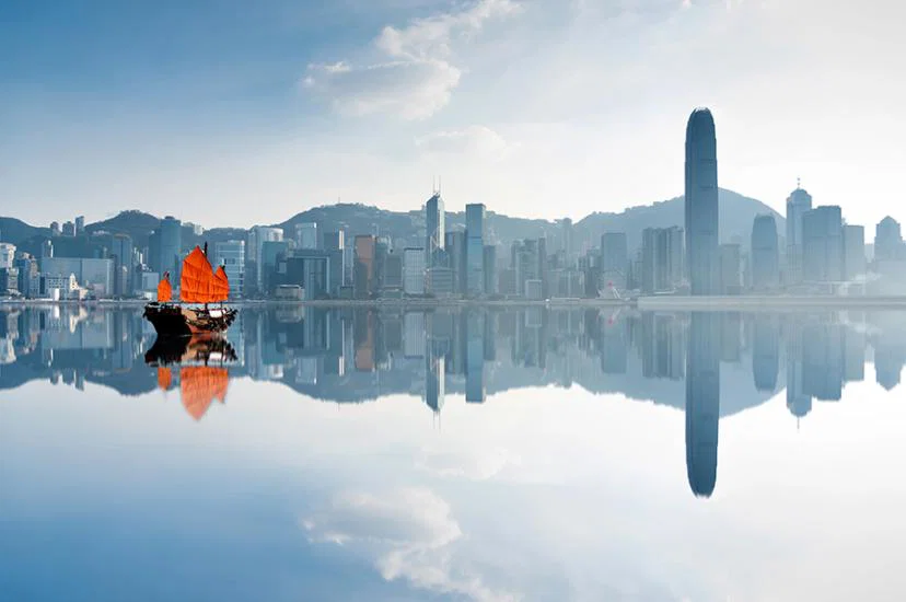 Hong Kong skyline and junk boat iStock