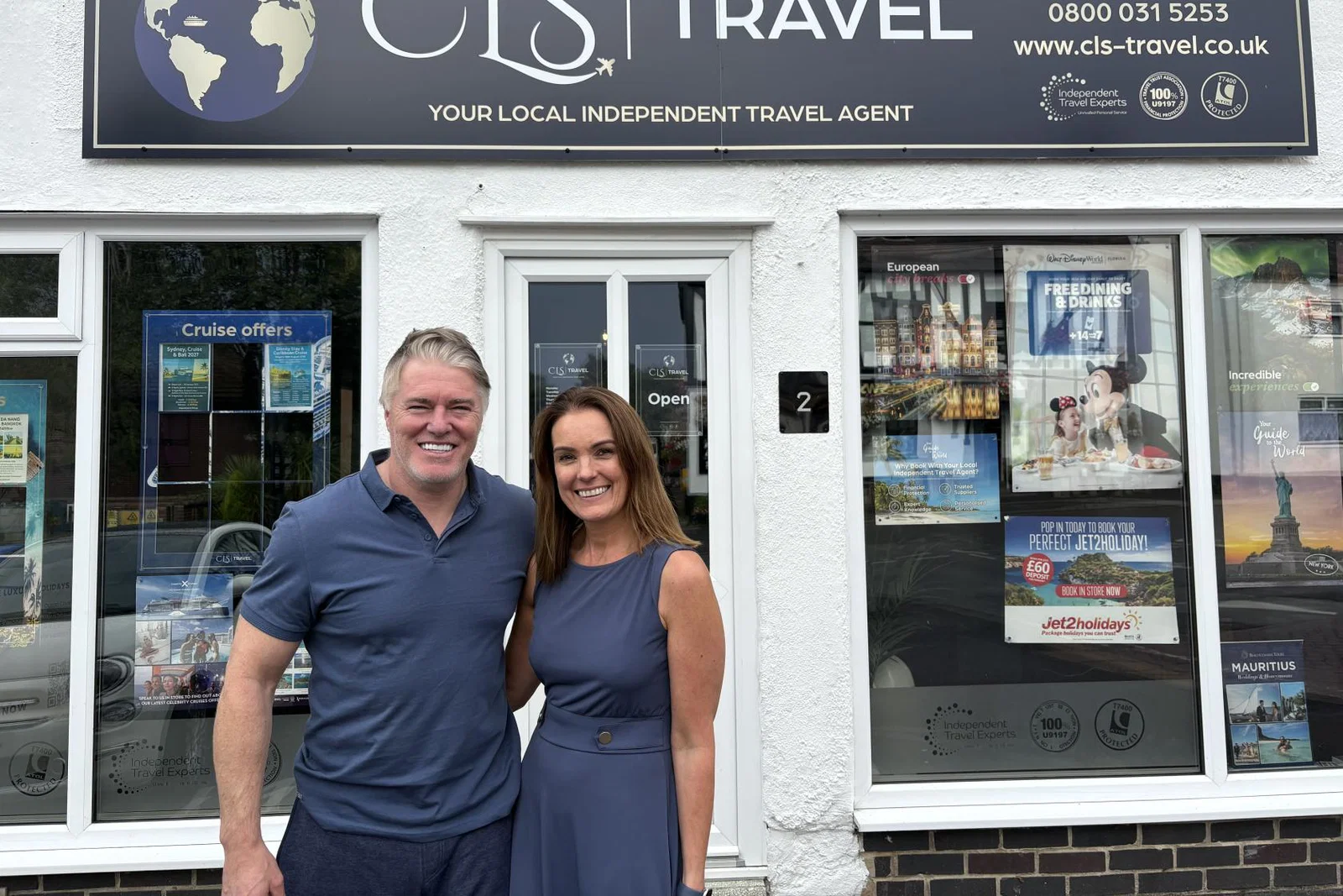 Rod and Clare Stege outside the first CLS Travel shop in Littleover 