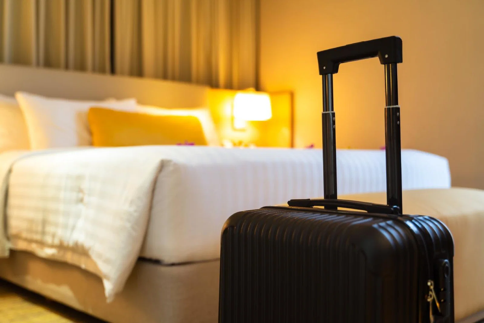 A suitcase delivered to a hotel room