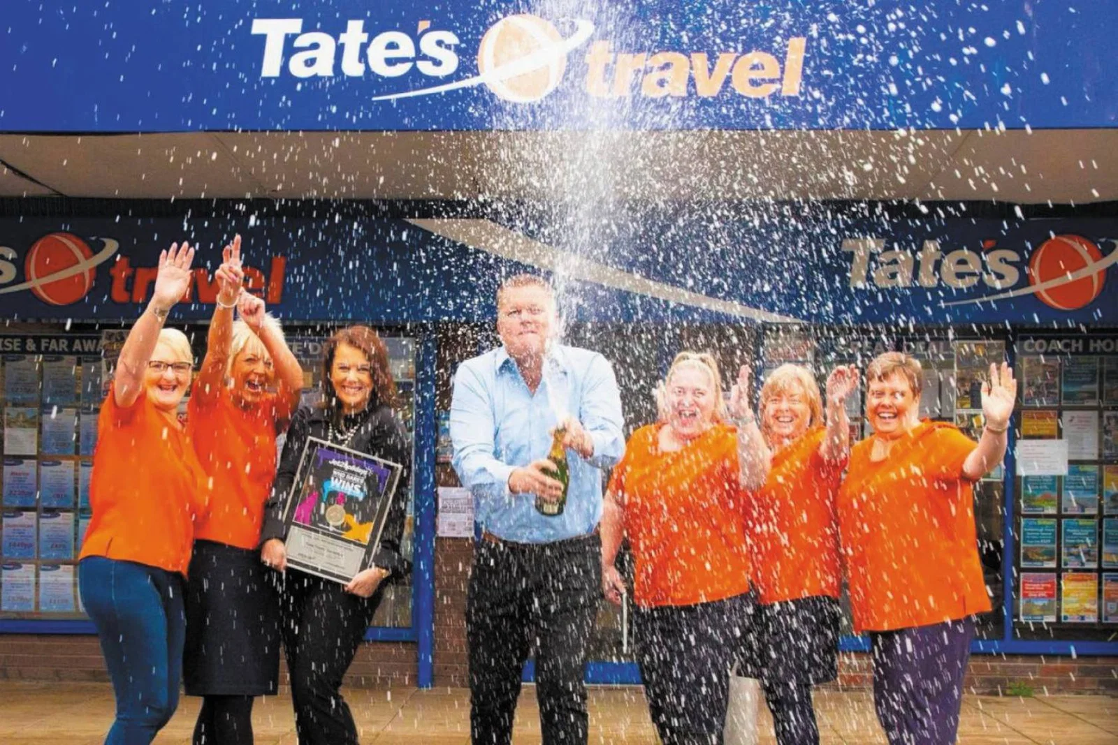 The team at Tates Travel celebrating its acquisition