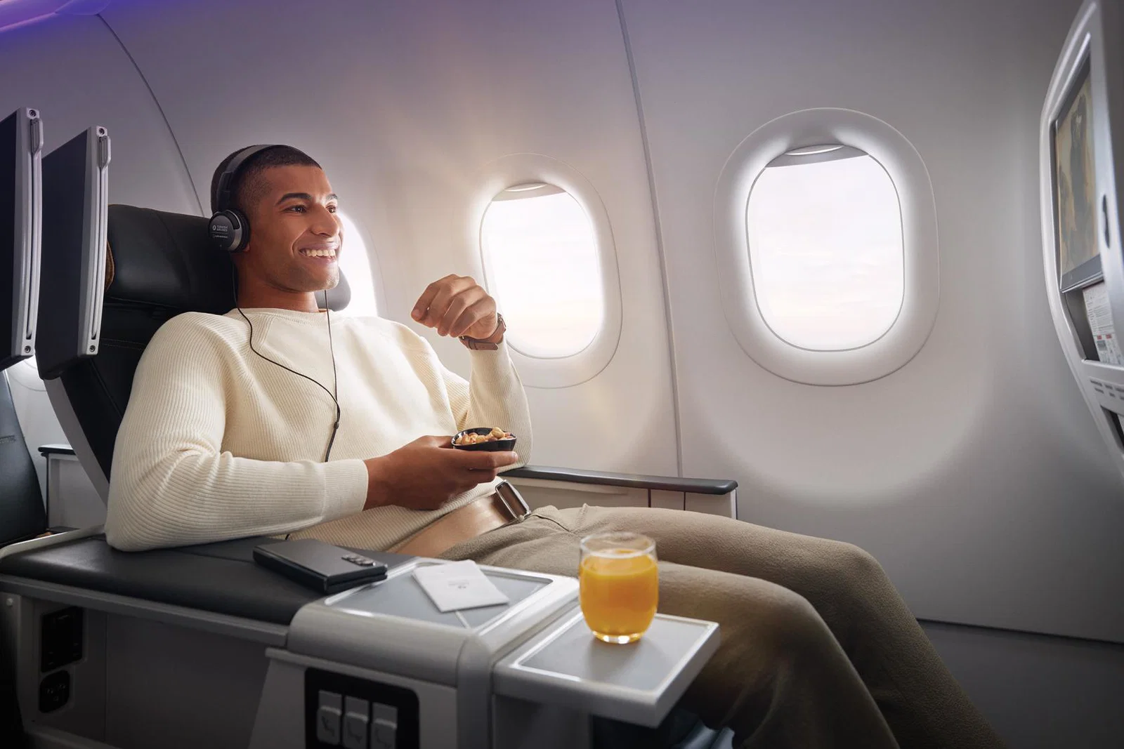 A male customer relaxes onboard with Turkish Airlines