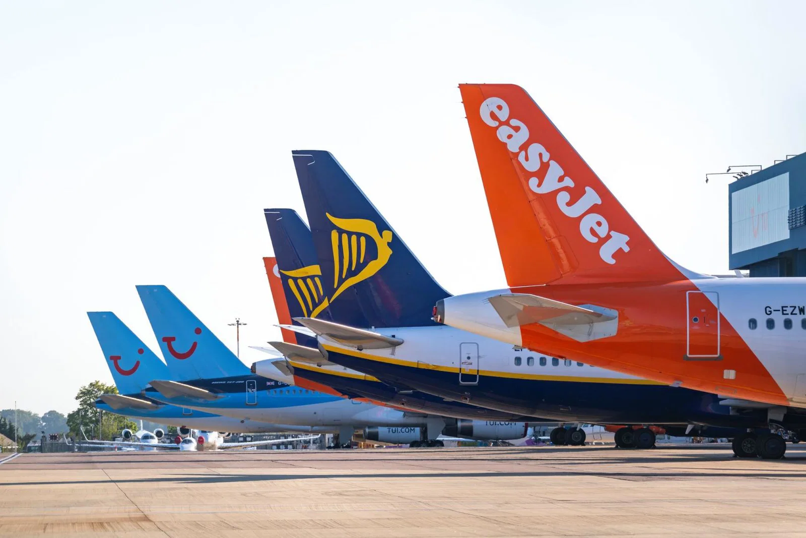 Tui, Ryanair and easyJet aircraft pictured at the stand at an airport