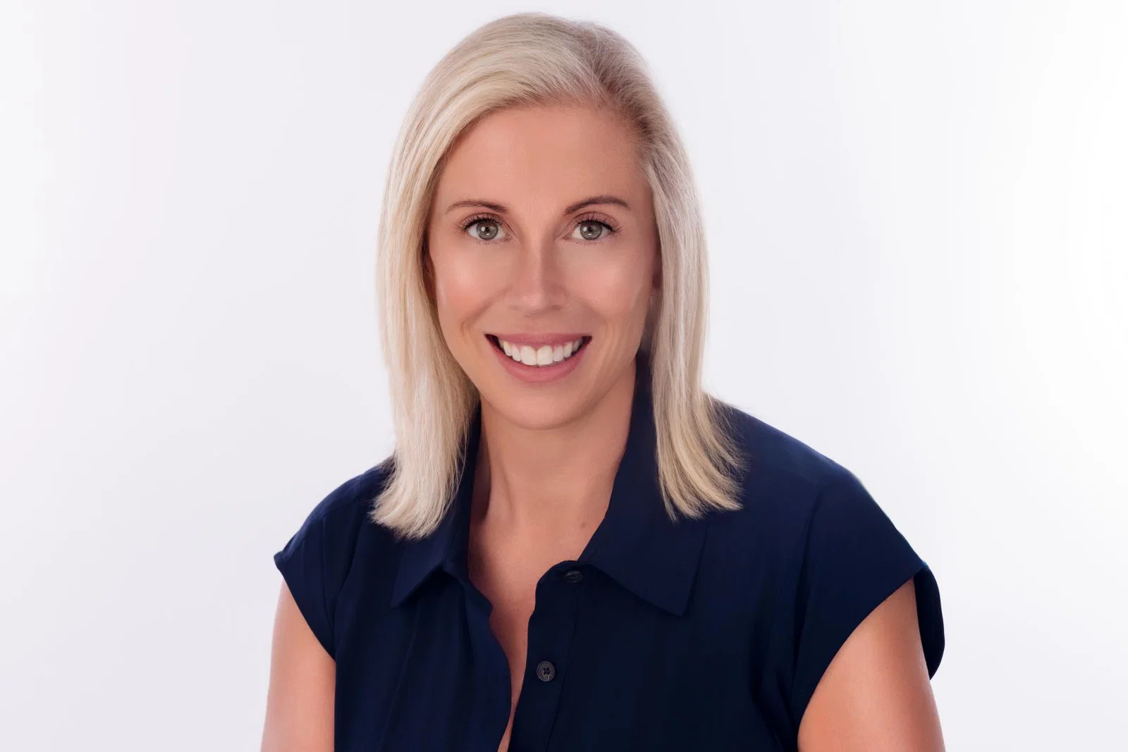 Headshot of woman with shoulder-length blonde hair smiling 