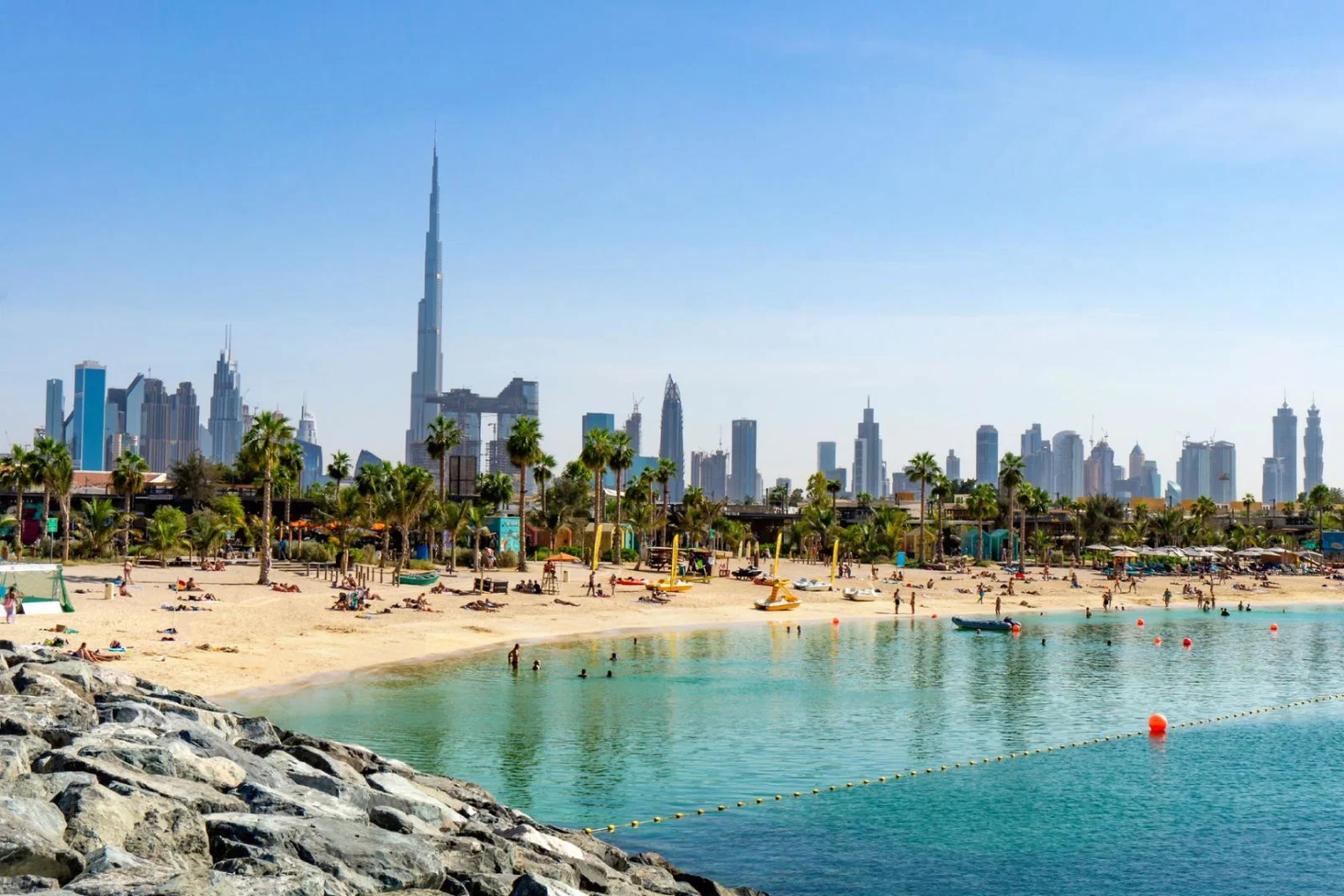 A beach in Dubai with the city pictured in the background