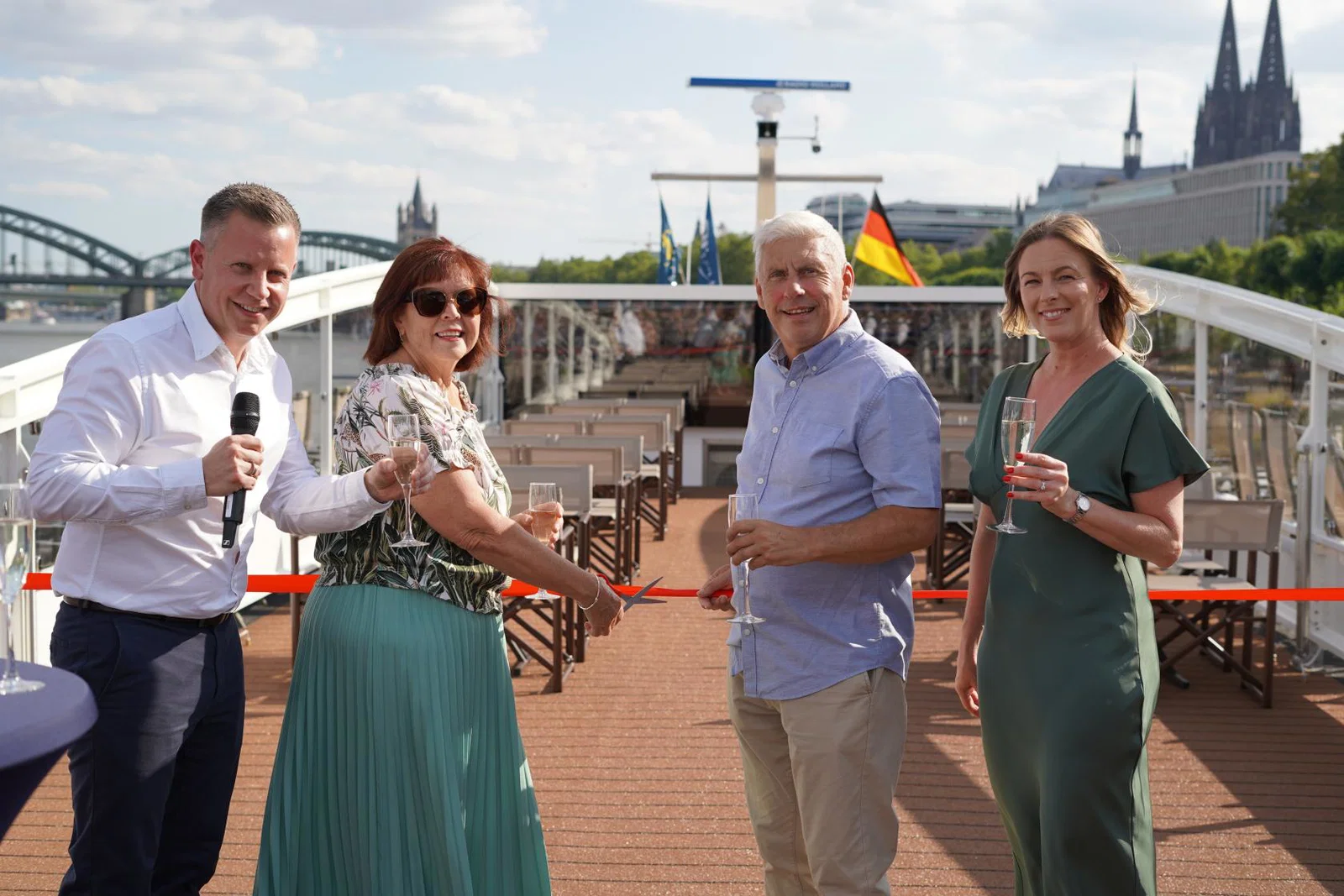 The very first guests to board Riviera Resplendence, Dave and Jacqui, were invited to cut the ceremonial ribbon with James Golding and Noeleen Pritchard
