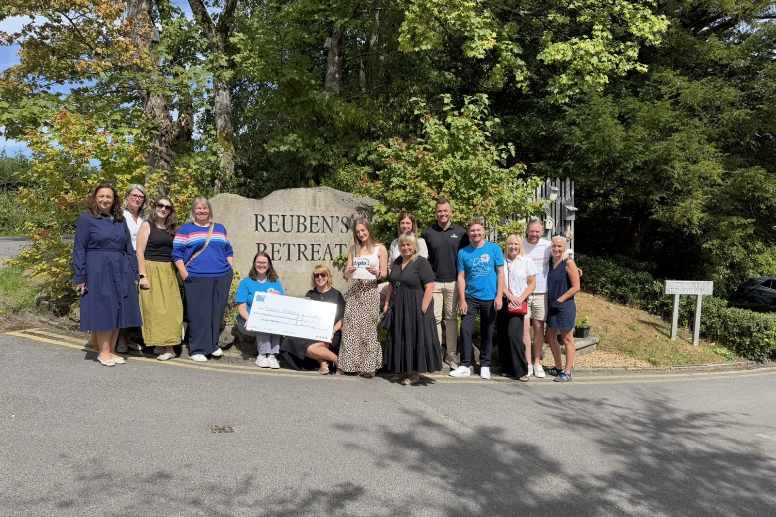 TIPTO Team Present the Cheque to Reuben's Retreat