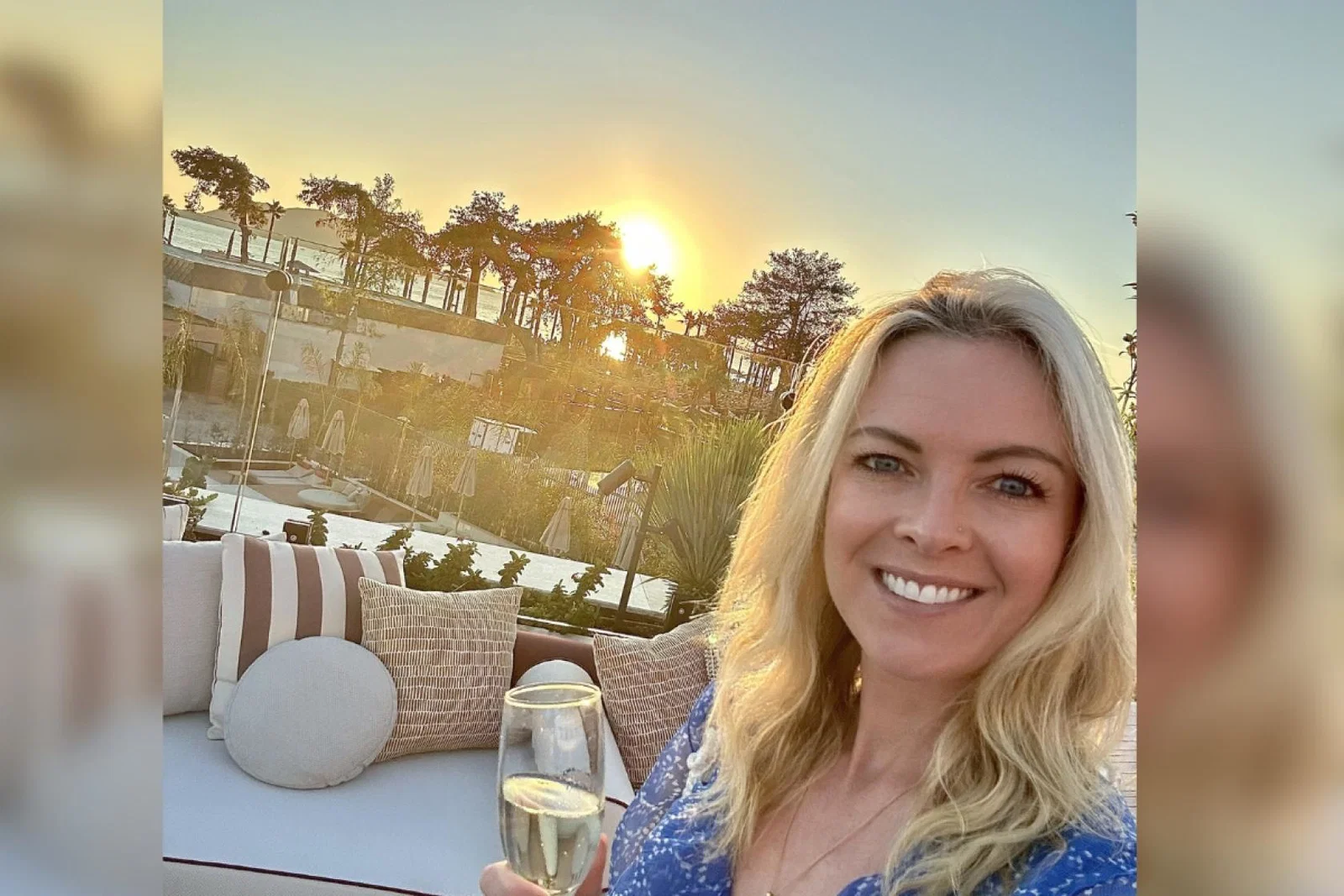 Blonde woman smiling with champagne 