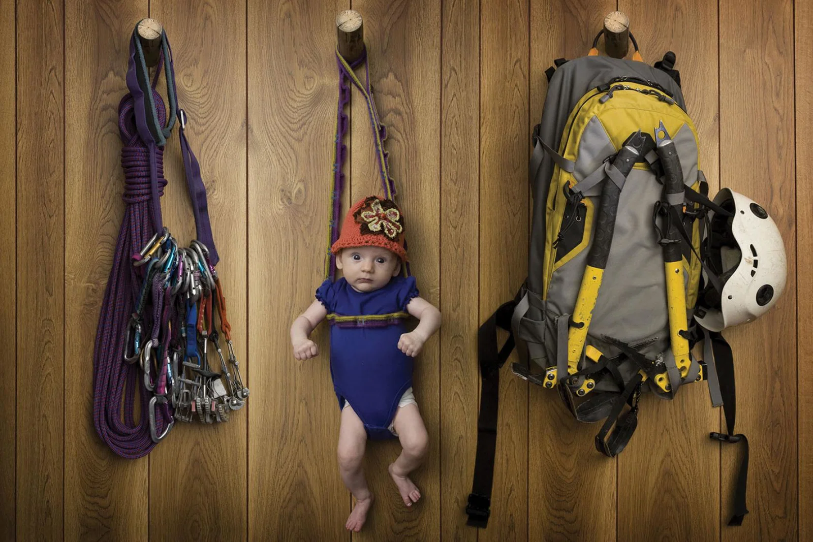 Adventure concept - baby with rock climbing gear (stock)
