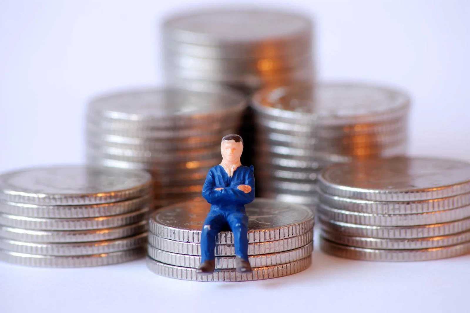 Tax / money - man on coins (stock)