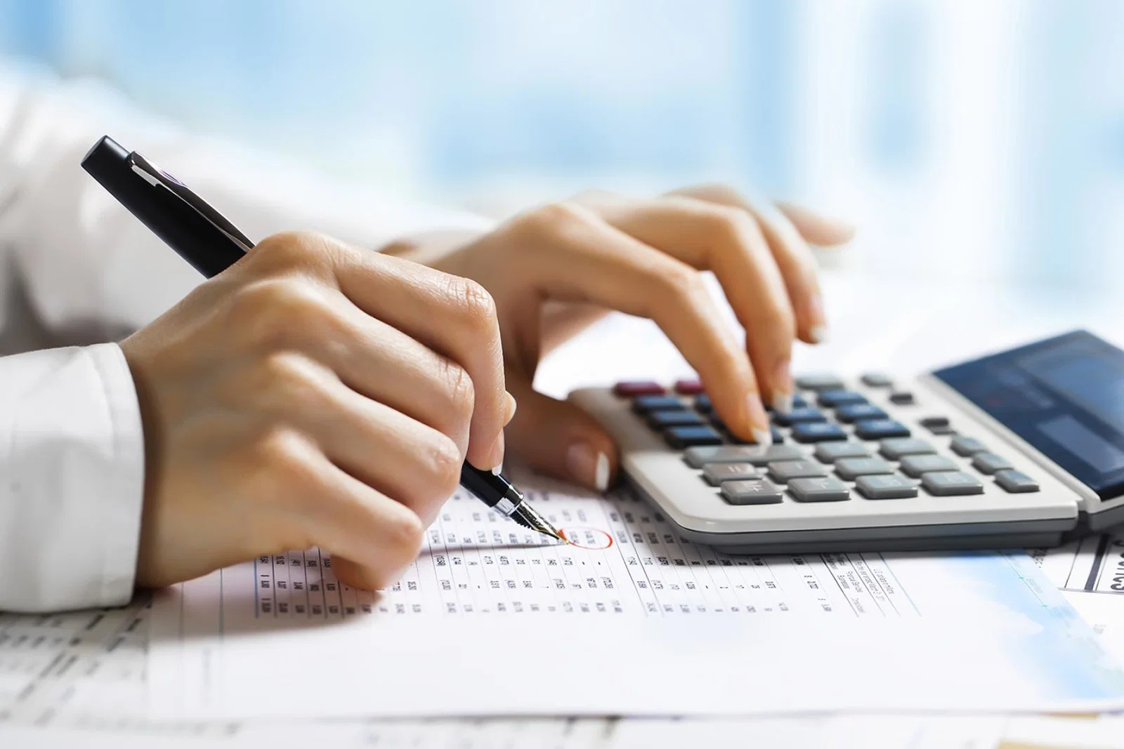 Accountancy - accountant uses calculator