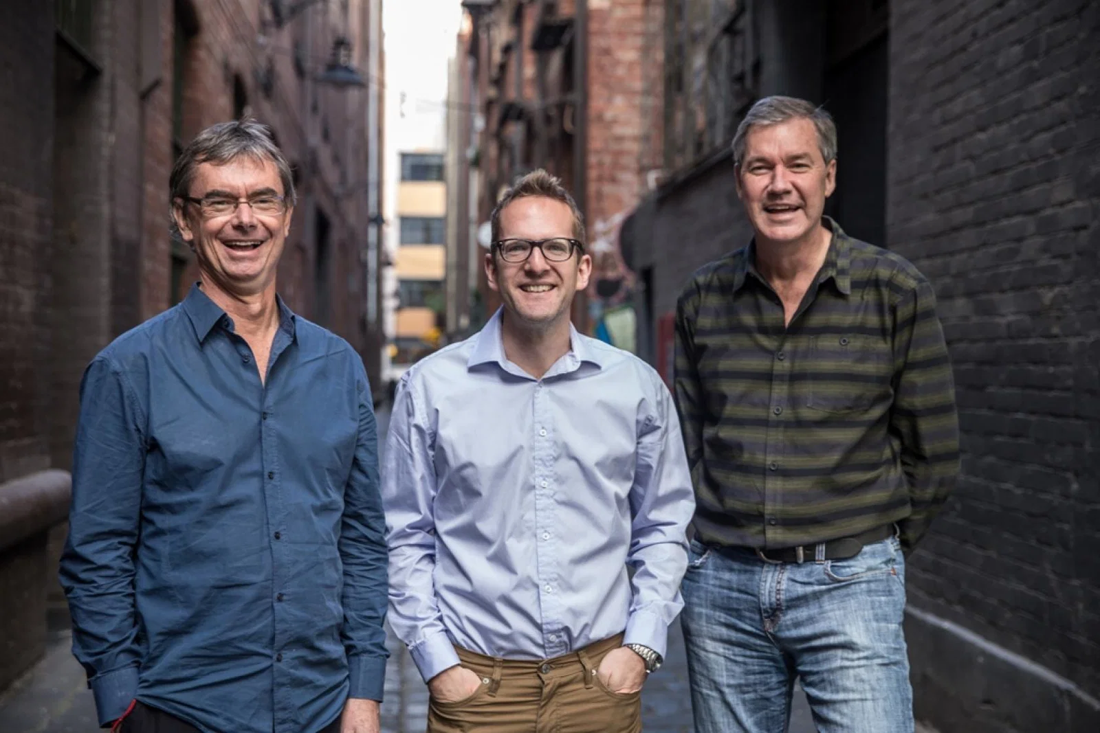 Intrepid Travel founders Geoff Manchester and Darrell Wade with group managing director, James Thorn