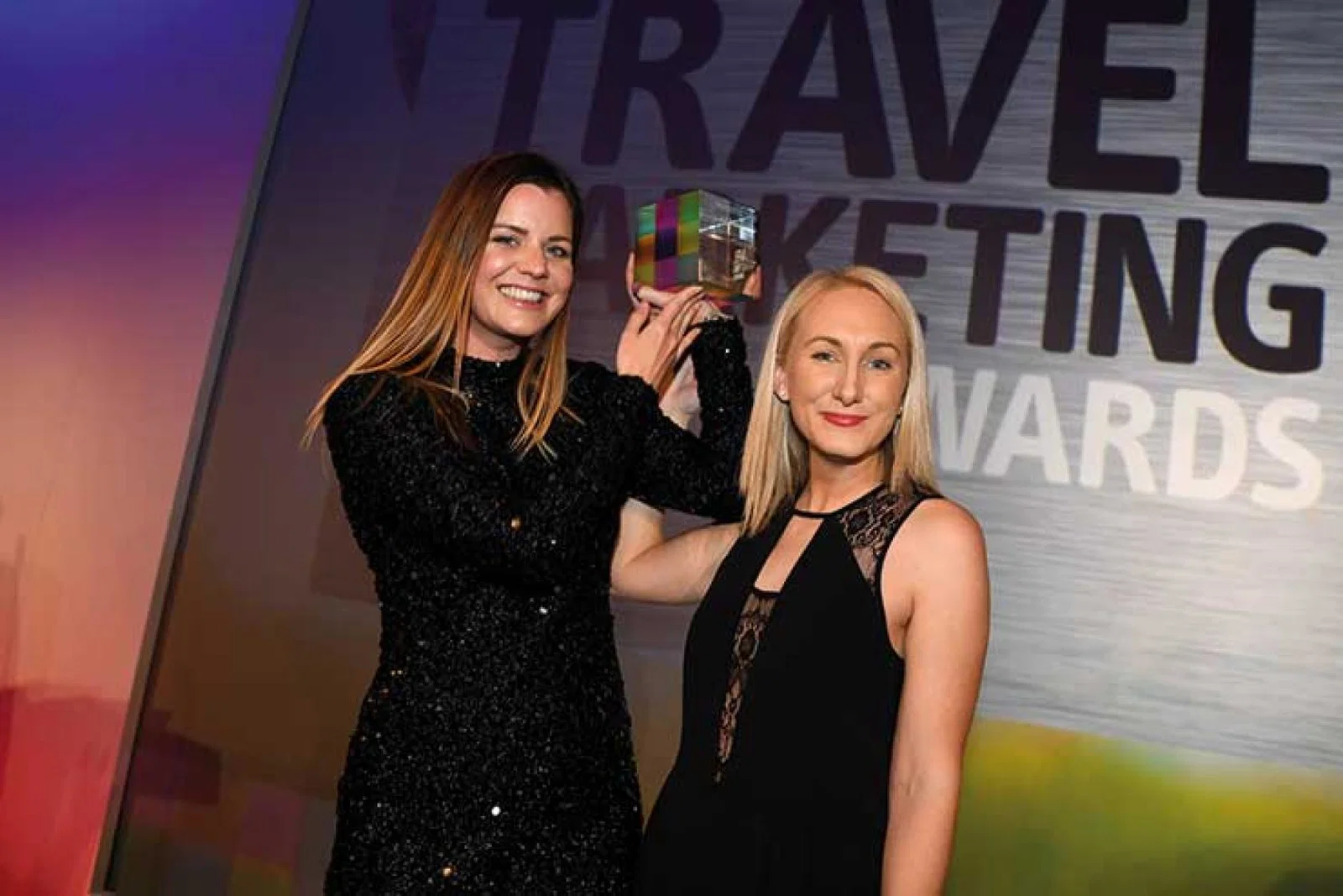 Travel Marketing Awards winners showing trophy