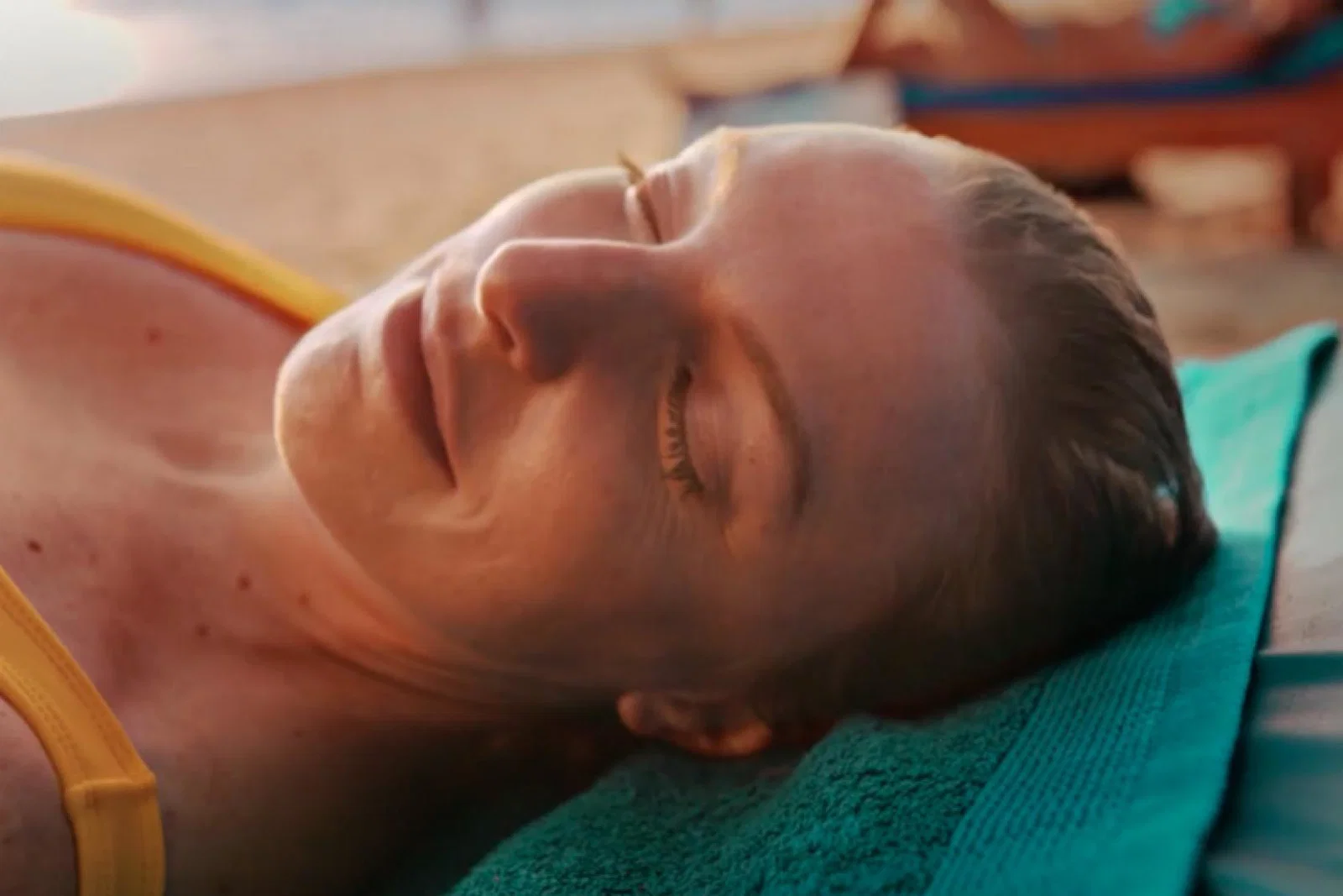 The campaign featured a number of people relaxing on the beach after terrible times