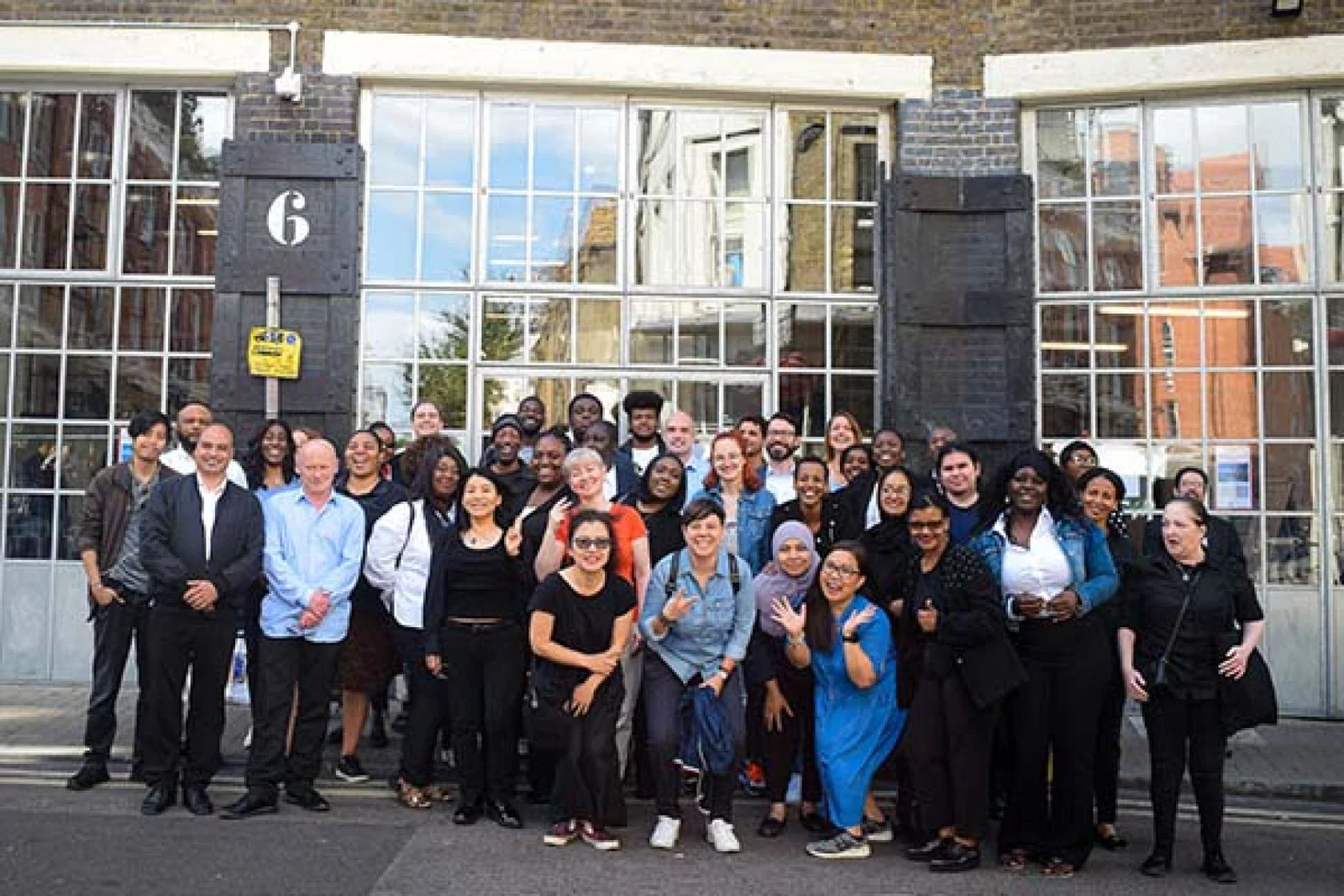 Students celebrate taking part in a recent hospitality training school with Saira Hospitality