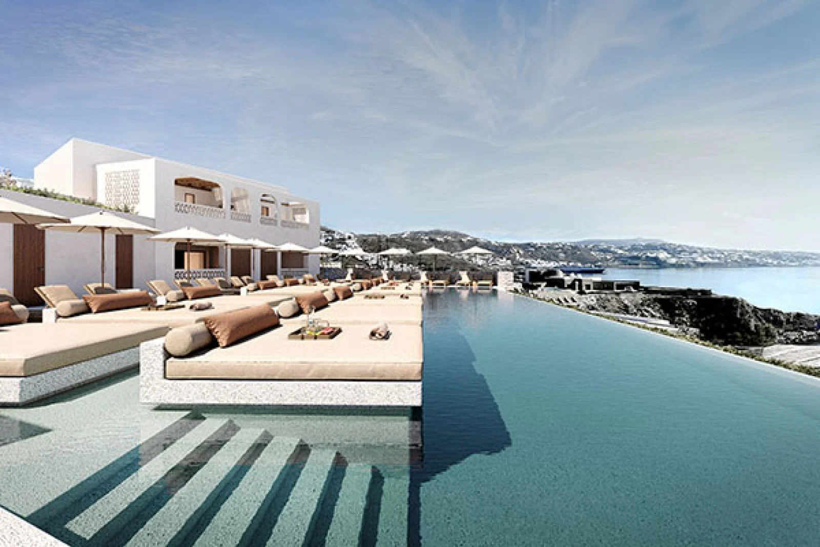 Guests can relax at the pool, looking out across the Aegean Sea