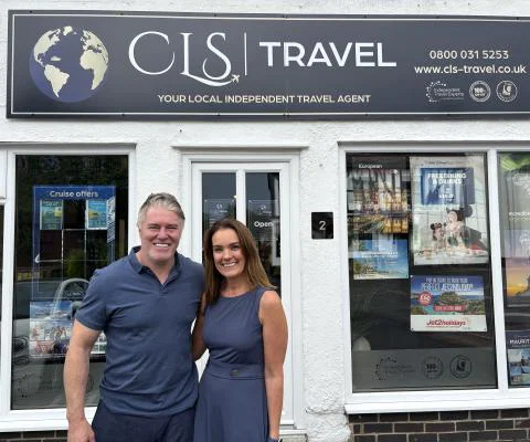 Rod and Clare Stege outside the first CLS Travel shop in Littleover 