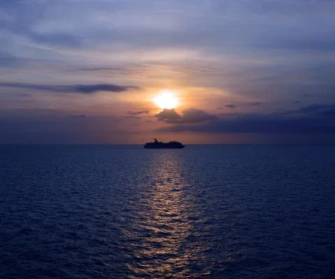 A cruise ship pictured at sea at dusk