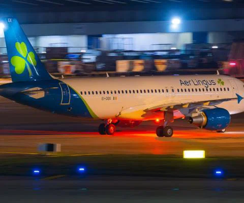 An Aer Lingus aircraft lands at Manchester airport