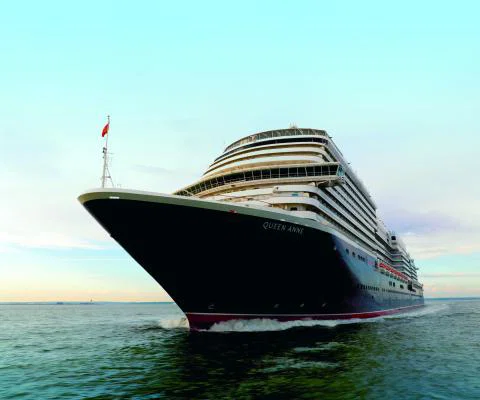Luxury cruise ship sailing on bright day 