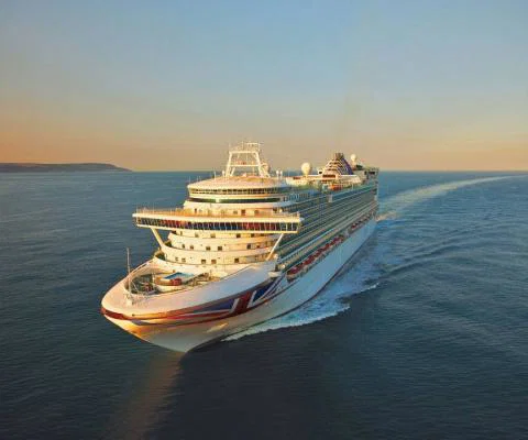P&O cruise ship sailing on open water during sunset