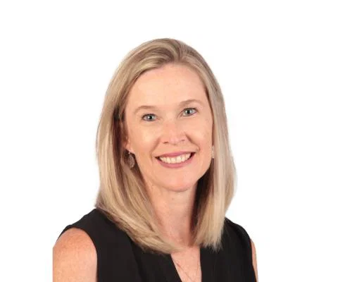 Headshot of white woman with shoulder-length blonde hair smiling 