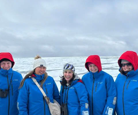 James (left) explored the Arctic with a group of agents on a recent fam