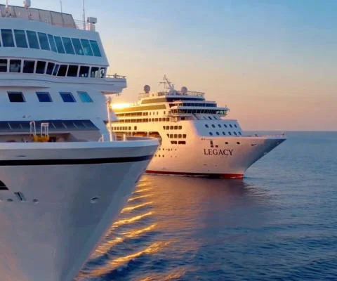 Two cruise ships in the sea with sunset 
