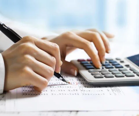 Accountancy - accountant uses calculator