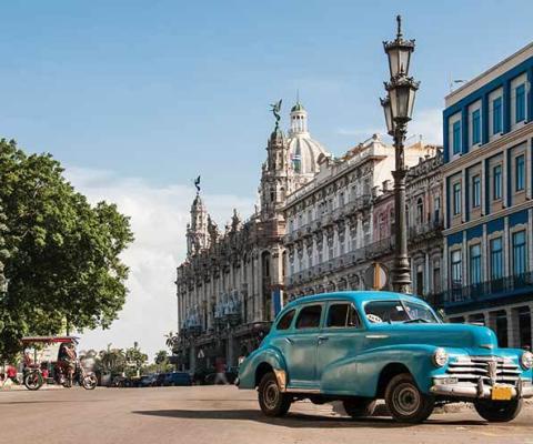 Cuban street scene with old car ThinkstockPhotos 513547468
