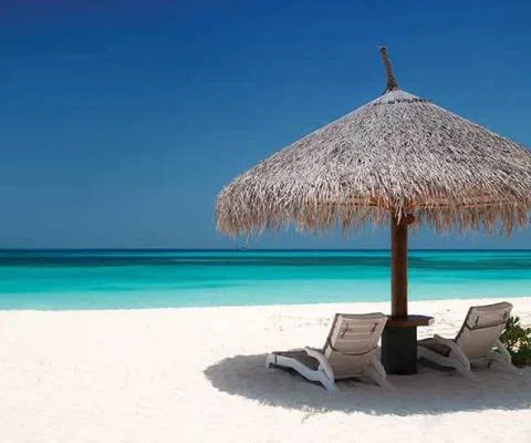 Beach-Chairs-and-Umbrella-on-a-beautiful-island-panoramic-v.jpg
