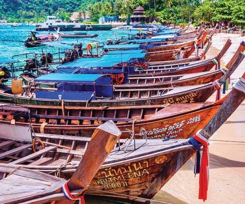 Boats on a Thailand beach iStock