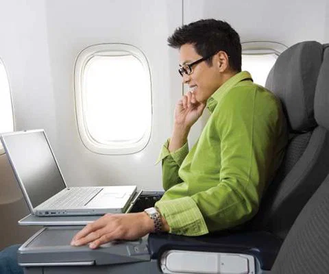 Laptop work on a flight iStock-172898489