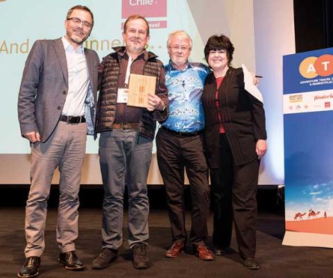 Pete Burrell winning the Contribution to Adventure Travel award at the Adventure Travel Conference i