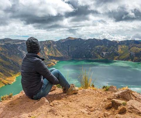 Hiker looking out over a lake