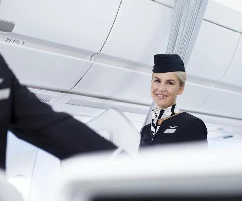 Finnair_A350_economy_class_flight_attendants_smiling_3.jpg