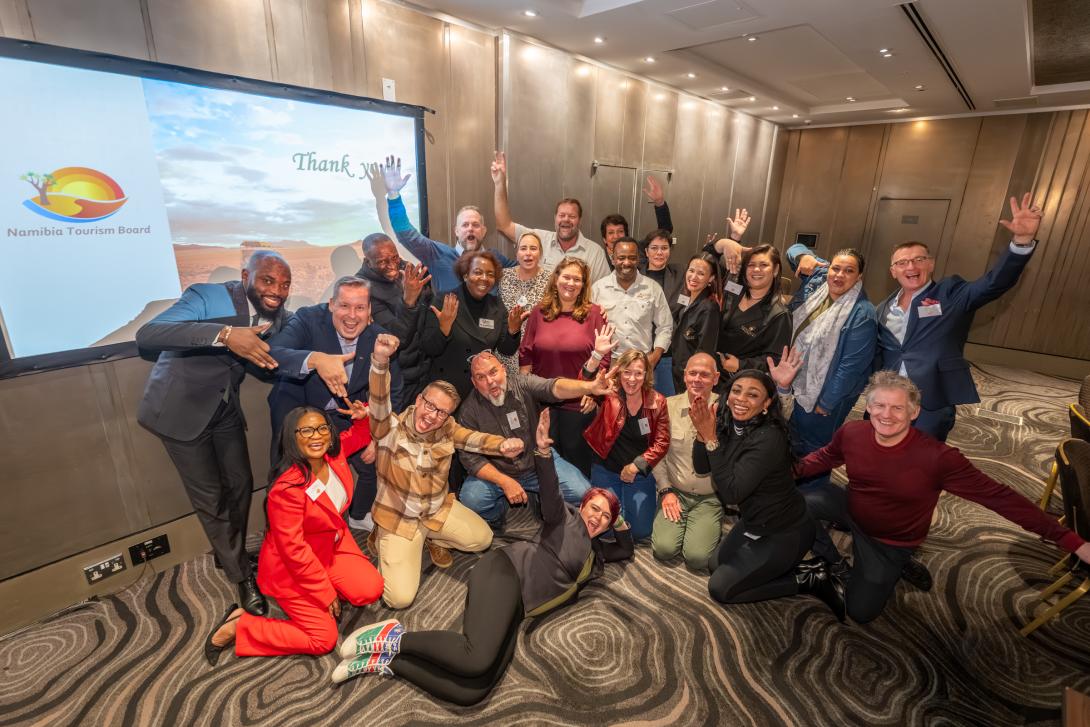 Group of travel agents and Namibia partners post for a photo