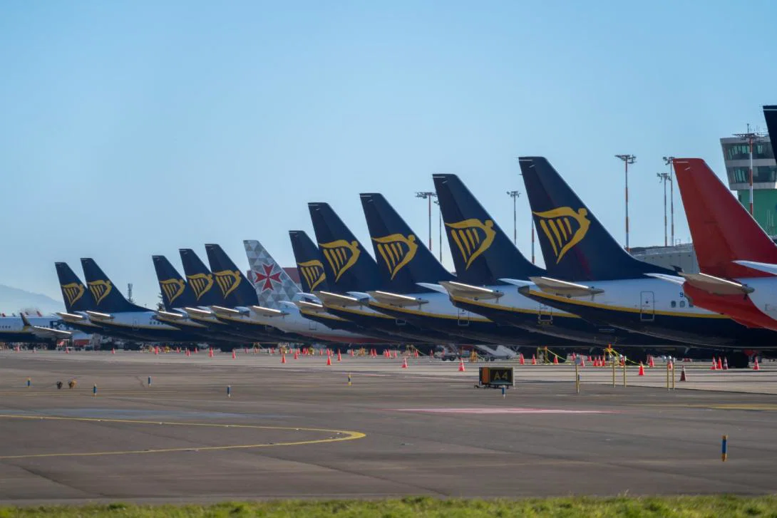 Ryanair aircraft lined up at the stand at an airport