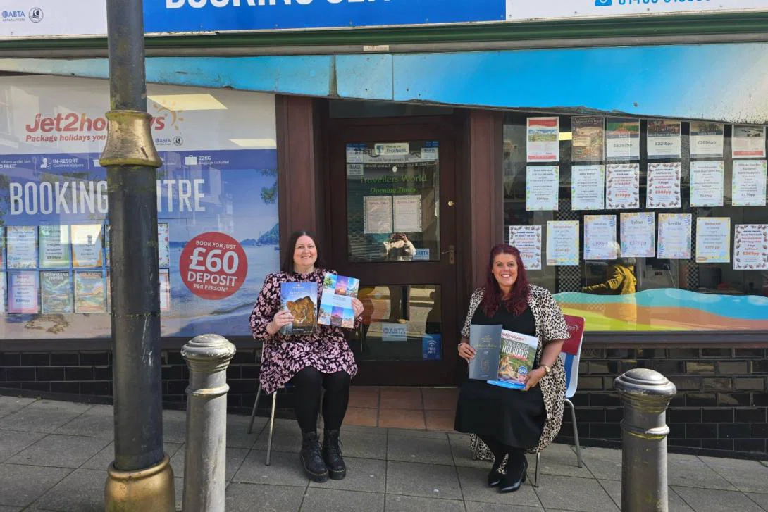 Travellers World team sitting outside premises in Brynmawr Travellers World team sitting outside premises in Brynmawr