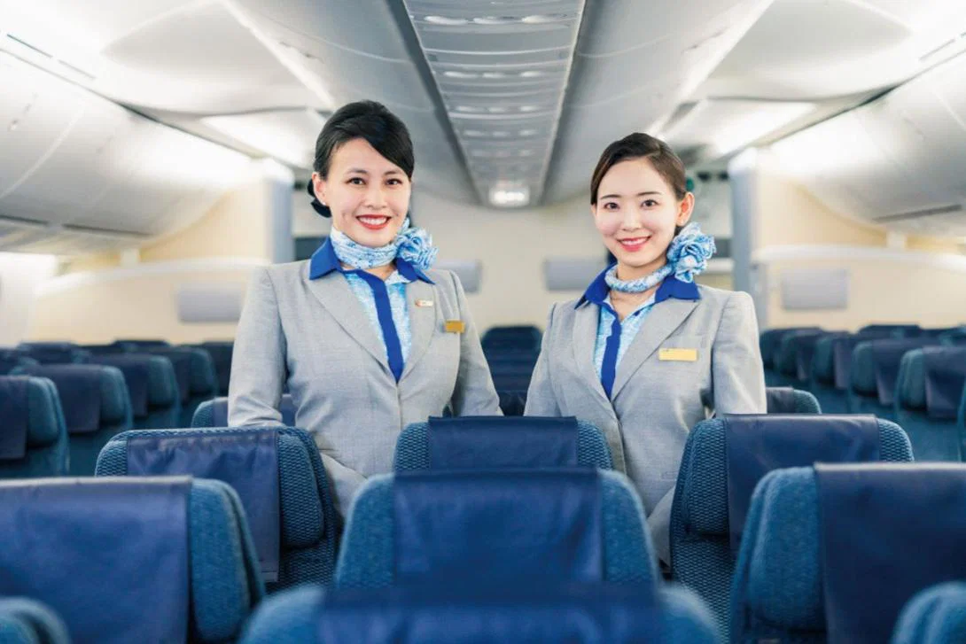 (credit: ANA) Smiling cabin crew onboard ANA aircraft