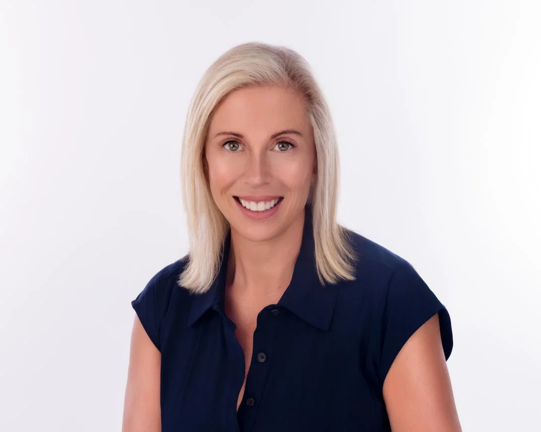 Headshot of woman with shoulder-length blonde hair smiling