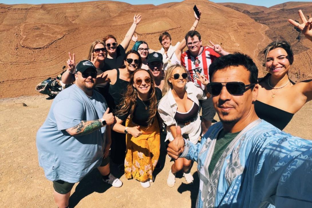 Vanessa Good Group of travellers pose for a selfie with guide