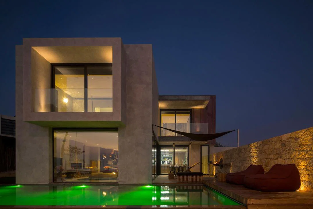 Luxury villa exterior at night