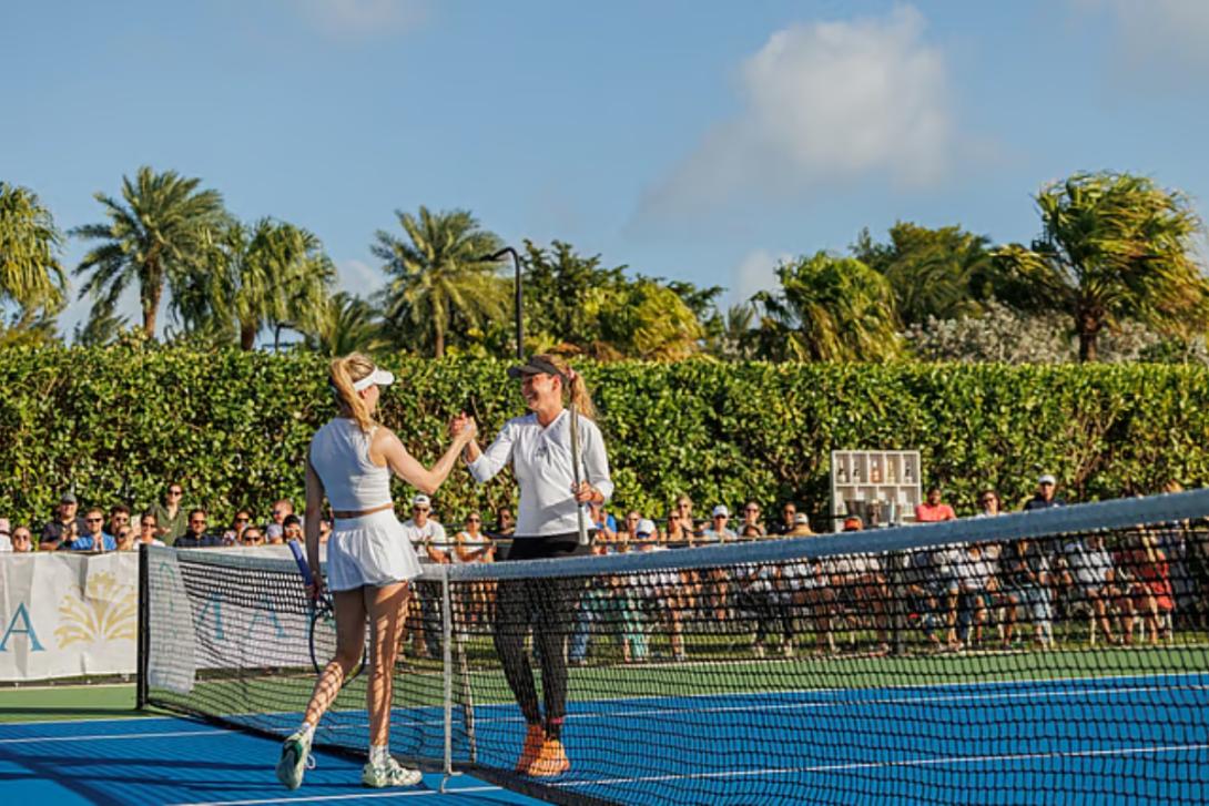 NPIPB Two female tennis players shake hands over the net