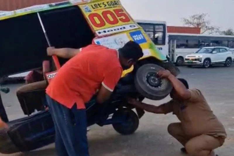 Local Indian men attempt to fix tuk-tuk Local Indian men attempt to fix tuk-tuk