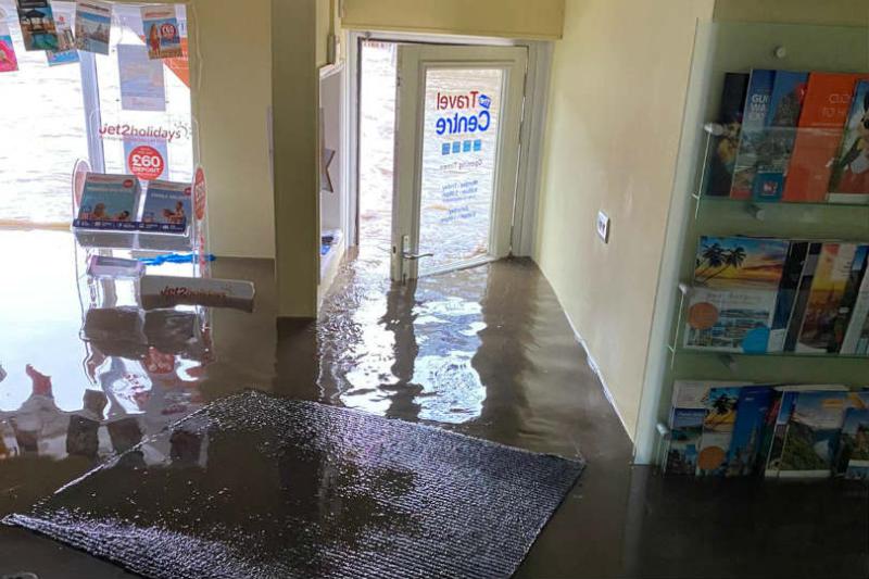 The Travel Centre's door was forced open during the flood