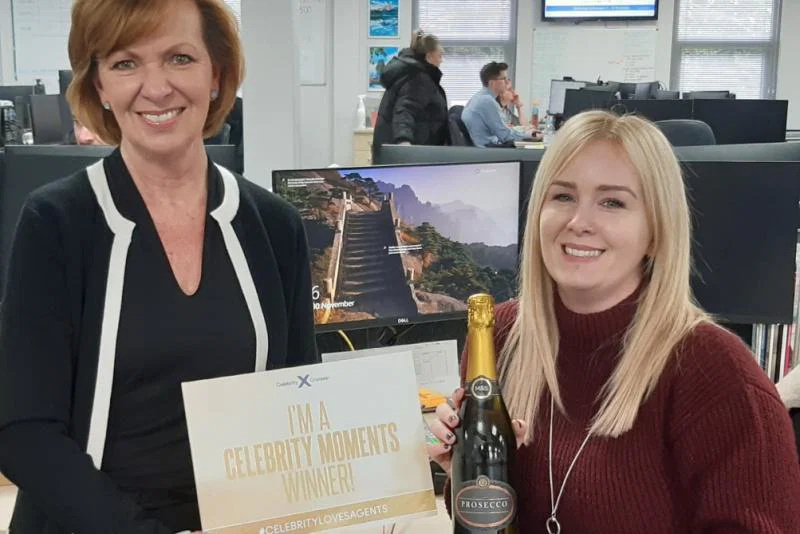 Katie Bowles from ROL Cruise (right) is rewarded by Celebrity's Ruth Gardiner
