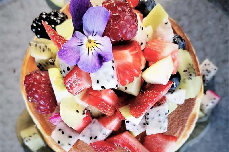 Santikos Collection's The NEST restaurant serves dishes including pancakes with fresh fruit