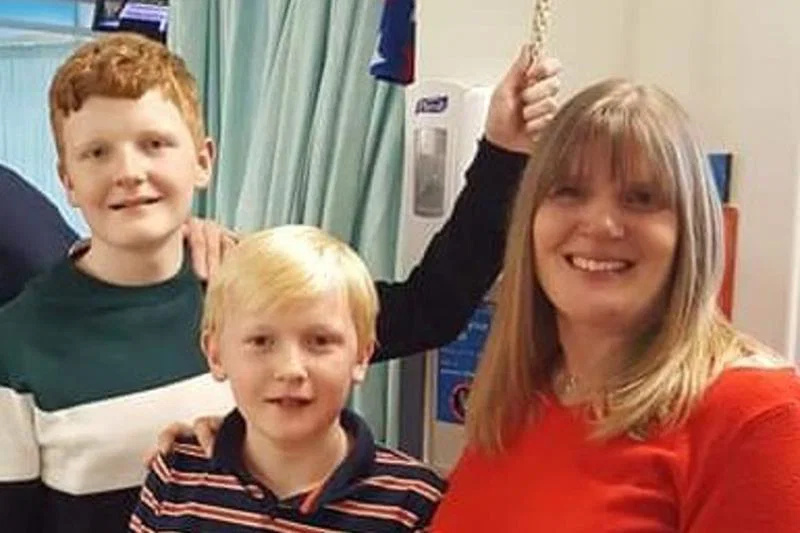 Susan, with her sons Aaron (left) and Ryan (centre) 